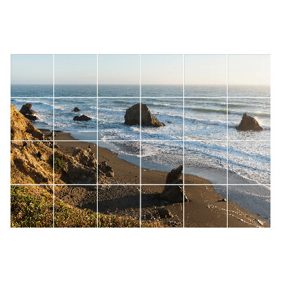 Autocolante gresie O plajă cu pietre și valuri